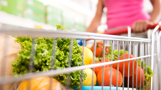 A shopping trolley filled with fresh vegetables